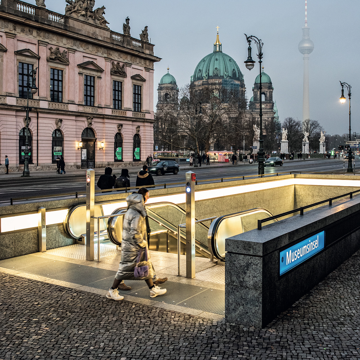 light subway entrance by night. no text.